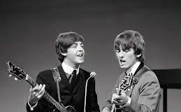 George Harrison, right, and Paul McCartney. Creative Commons