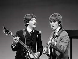 George Harrison, right, and Paul McCartney. Creative Commons