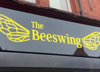 Outdoor sign of Beeswing Bar