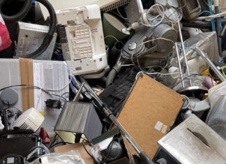 A variety of recycling waste, such as hoovers, toasters and plastics.