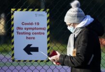 A person queues at a Covid testing centre