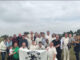 Earlestown Cricket Club holding their banner