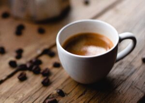 Warming cup of coffee. Photo by Andres Vera via Unsplash.com