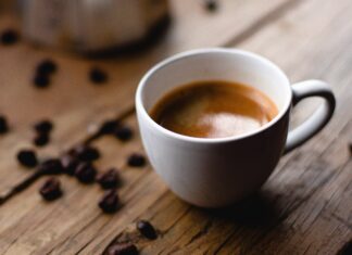 Warming cup of coffee. Photo by Andres Vera via Unsplash.com