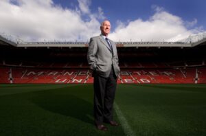 SIR BOBBY CHARLTON PICTURED ON THE TURF AT OLD TRAFFORD HOME OF MANCHESTER UNITED