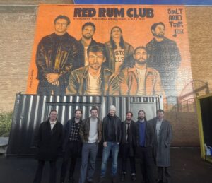 Pictured are the band Red Rum Club and artist Paul Curtis with the recently unveiled mural.