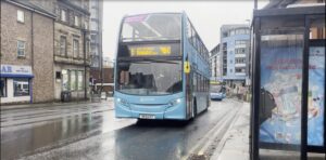 A bus pulling into a bus lane. 