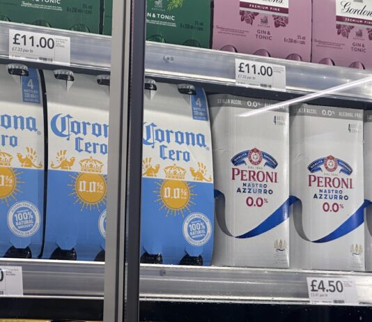 Non-alcholic and 0% beverages in a fridge at CO-OP waiting to be sold.