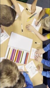 Children engaging in colouring task (c) Lucas McGrath