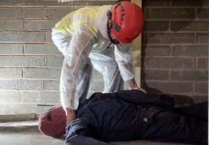 LJMU police student with overalls and helmet begins to retrieve casualty in ESTC day