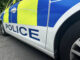 Man arrested after drugs and cash seized in Speke Side of a police car