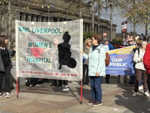 Protesters for Save Liverpool Women's Hospital holding a banner. Photo (c) Rebecca Thompson