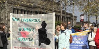 Protesters for Save Liverpool Women's Hospital holding a banner. Photo (c) Rebecca Thompson