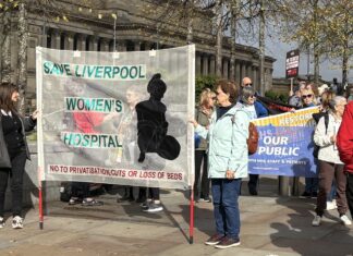 Protesters for Save Liverpool Women's Hospital holding a banner. Photo (c) Rebecca Thompson
