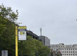 Image of a bus stop and Arriva bus in the background, on Brownlow Hill.