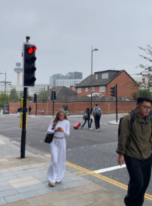 Image of pedestrians and a crossing, on the Brownlow Hill and Clarence Street junction.