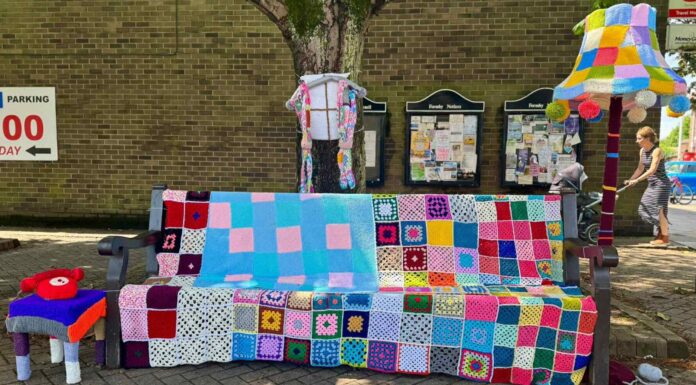Formby Yarn Bombers stitch together community spirit with festive trail Knitted bench and lamp in Formby village. Photo (C) Leanne Jones