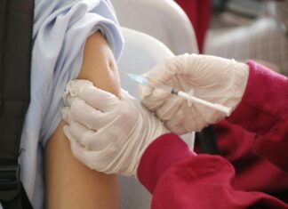 A patient receives a vaccine
