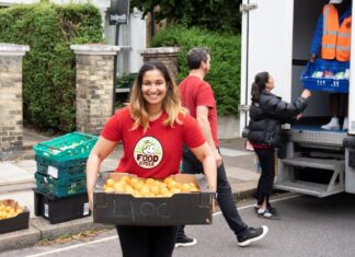 Image of FoodCycle volunteer helping (c) Deb James, FoodCycle