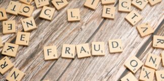 Scrabble tiles spelling out the word Fraud