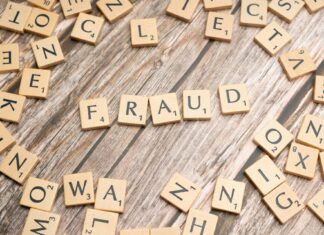 Scrabble tiles spelling out the word Fraud
