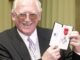 Iconic Liverpool artist commemorated with release of new Everton prints An image of Bill Tidy smiling as he receives his MBE