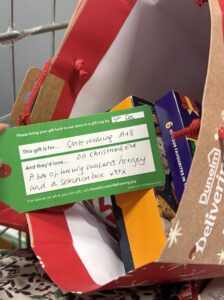 Christmas tag hanging on a Christmas present 