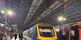 Image shows train stationary at Liverpool Lime Street train station