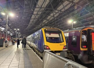 Image shows train stationary at Liverpool Lime Street train station