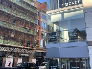 Street view of Cricket with 'closing down' on the windows. Anasimone Ibrahim