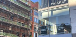Street view of Cricket with 'closing down' on the windows. Anasimone Ibrahim