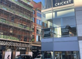 Street view of Cricket with 'closing down' on the windows. Anasimone Ibrahim