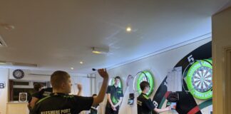 Image shows Ellesmere Port Darts Academy, players throwing darts at board