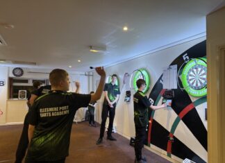 Image shows Ellesmere Port Darts Academy, players throwing darts at board