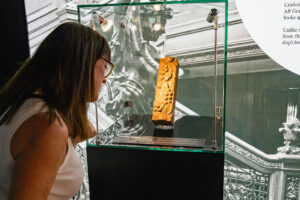 Woman looking at artifact. Photo (c) Lee Hill