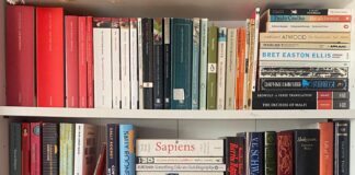 An Image of a range of books on a book shelf.