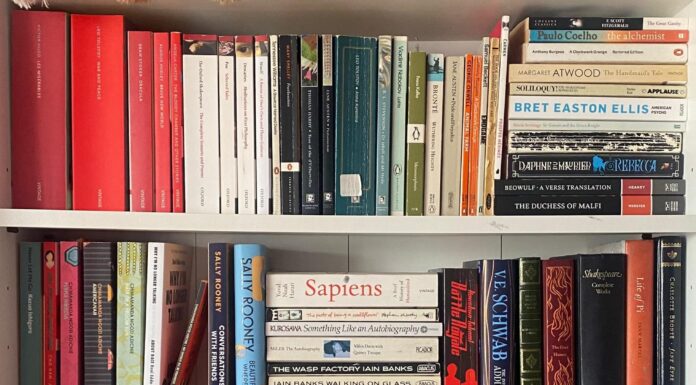 An Image of a range of books on a book shelf.
