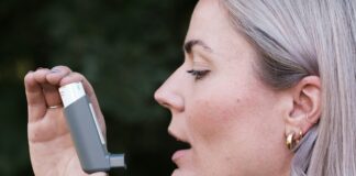 Woman using inhaler