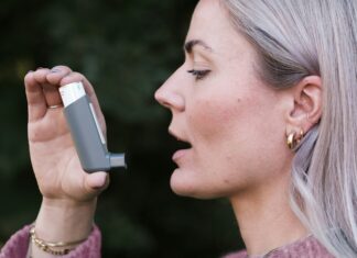 Woman using inhaler