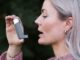 New digital technology to assist asthma patients Woman using inhaler