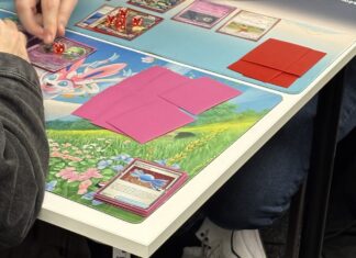 People playing Pokémon card game. Photo (c) Chloe McLoughlin