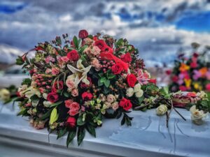 flowers on coffin (credit - unsplashed)
