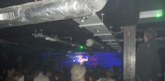 A busy crowd in a small venue