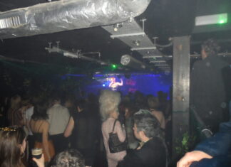 A busy crowd in a small venue