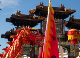 Chinese dragon dance in front of the Chinatown arch.