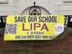 save LIPA poster outside the school