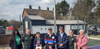 North West Ambulance Service workers, Tennis Club Secretary and members, stood left to right.