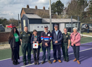 North West Ambulance Service workers, Tennis Club Secretary and members, stood left to right.
