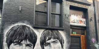 A photo of a mural of Oasis at site 3 of the music trail