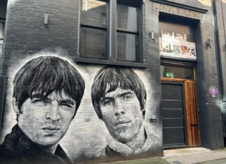 A photo of a mural of Oasis at site 3 of the music trail